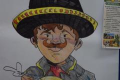 Zdjęcie przedstawia rysunek Meksykanina ubranego w tradycyjny kapelusz i strój, grającego na ukulele, nawiązujący do kultury Meksyku.
